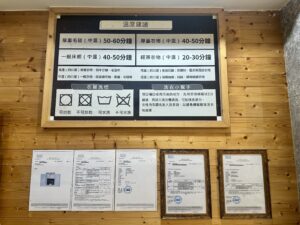 Retro camera and potted plant on wooden surface with copy space.