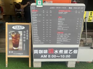 Retro camera and potted plant on wooden surface with copy space.